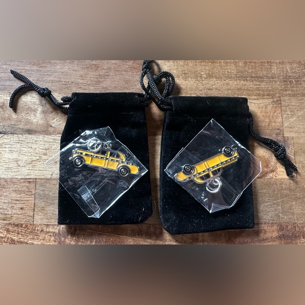 2 Yellow Taxi Cab Charms with black velvet draw string bag